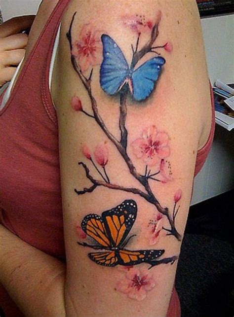 butterfly tattoo with flowers around it|butterfly turning into flowers tattoo.